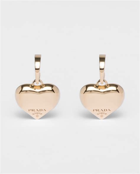 prada gold gold earrings.